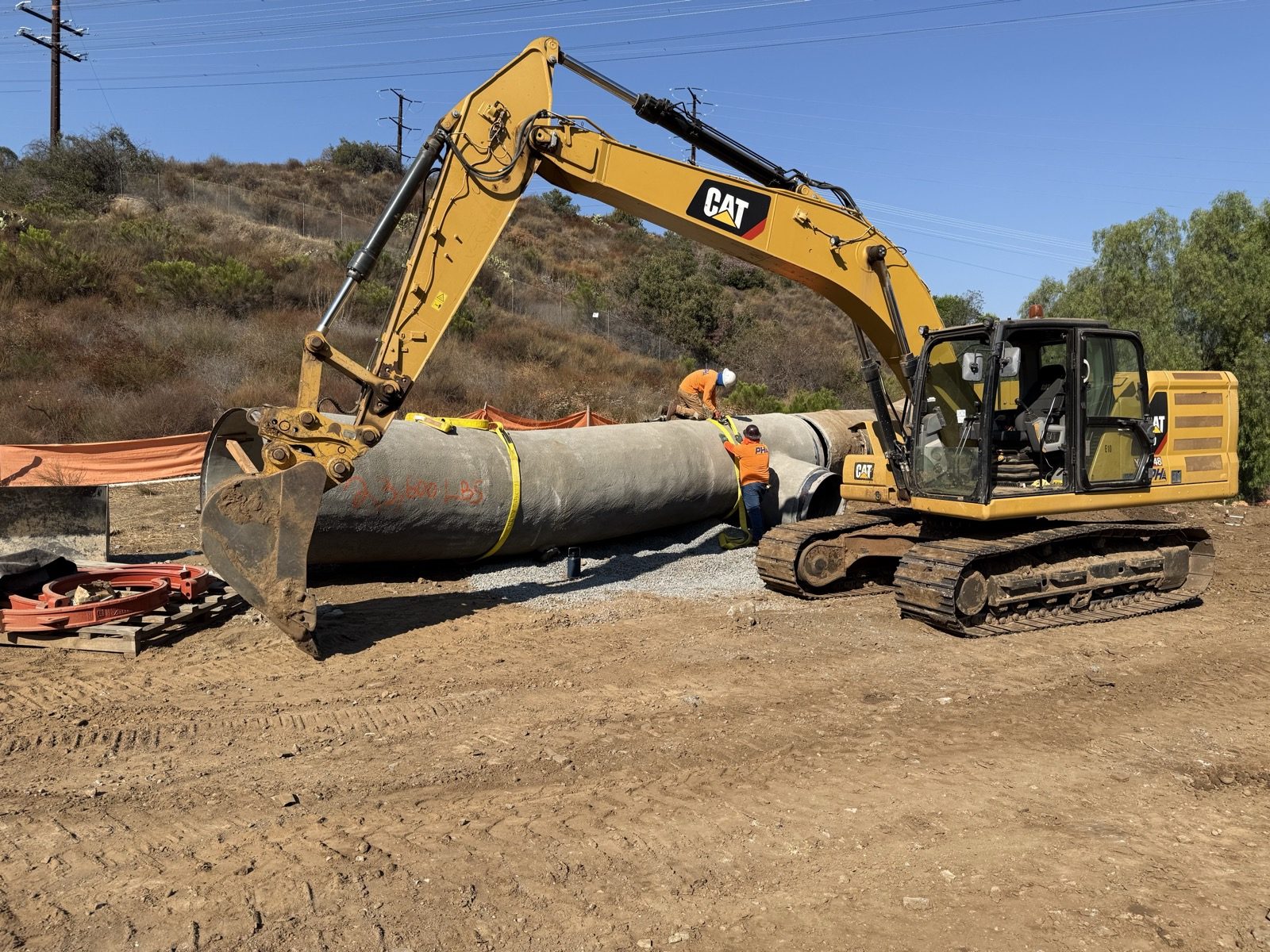 Large pipe with excavator