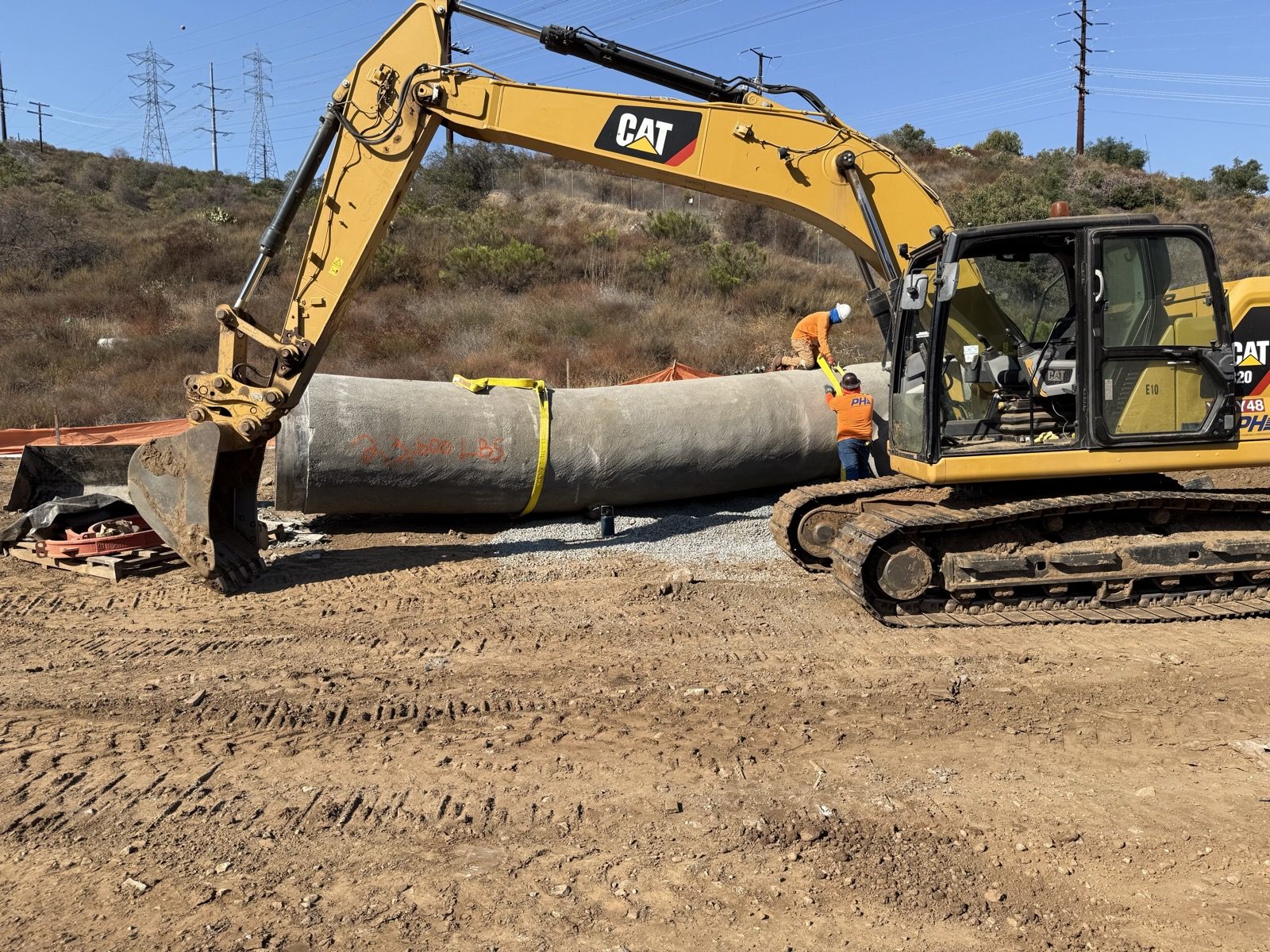 Excavator with pipe